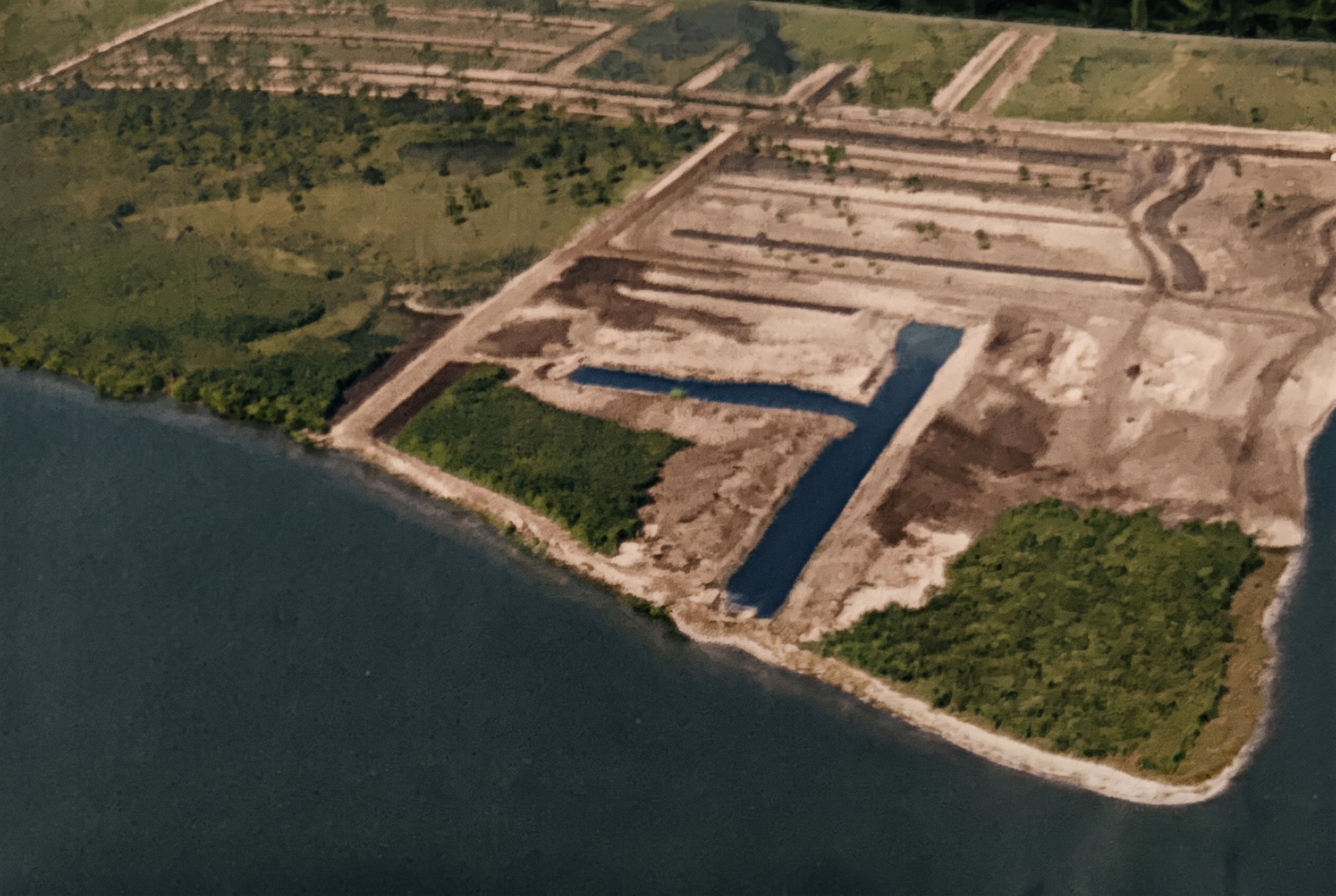 Colorized 1958 aerial of Redfish Point with the first Cape Coral canals and yacht basin