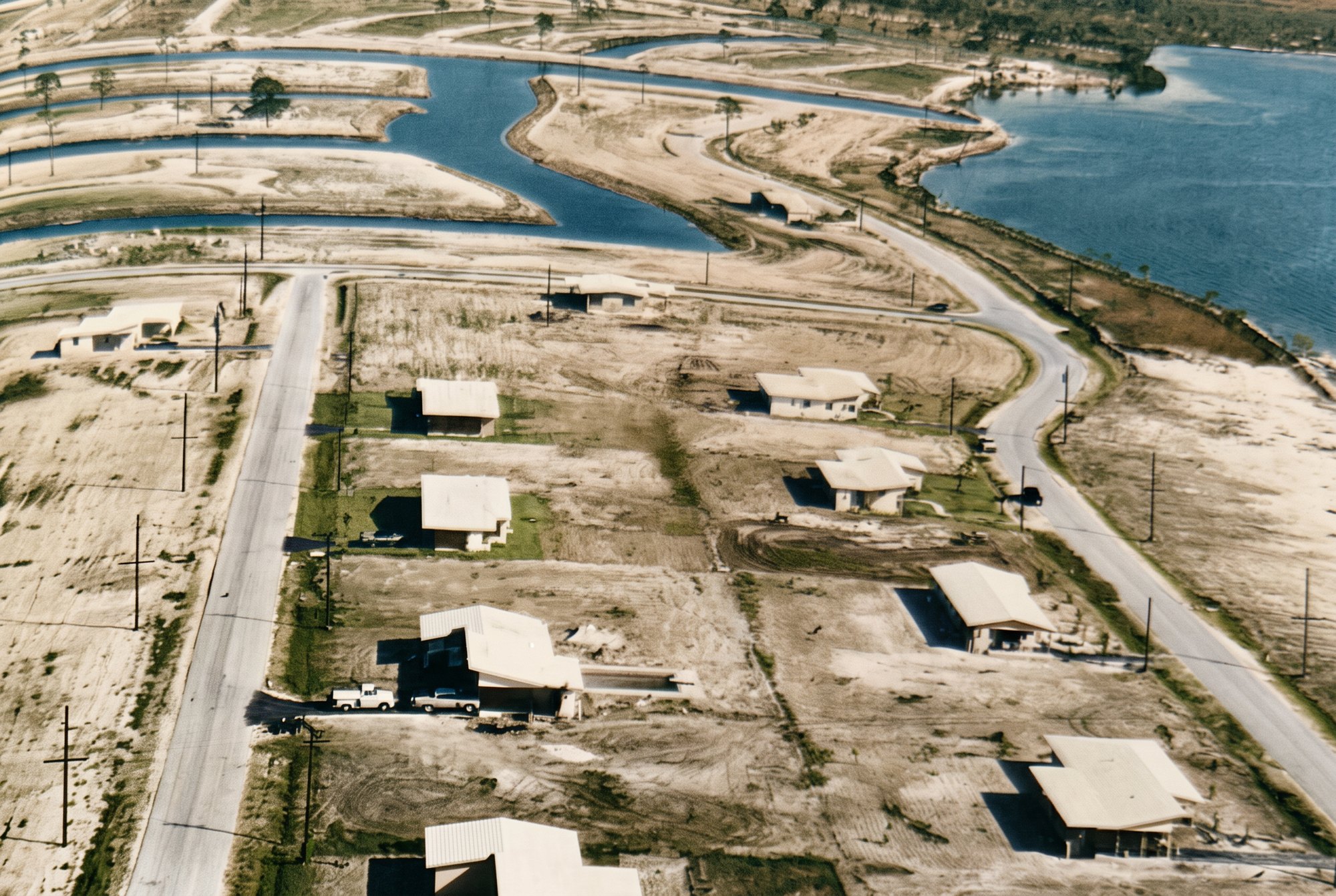Colorized 1958 aerial of the first Cape Coral homes along the water