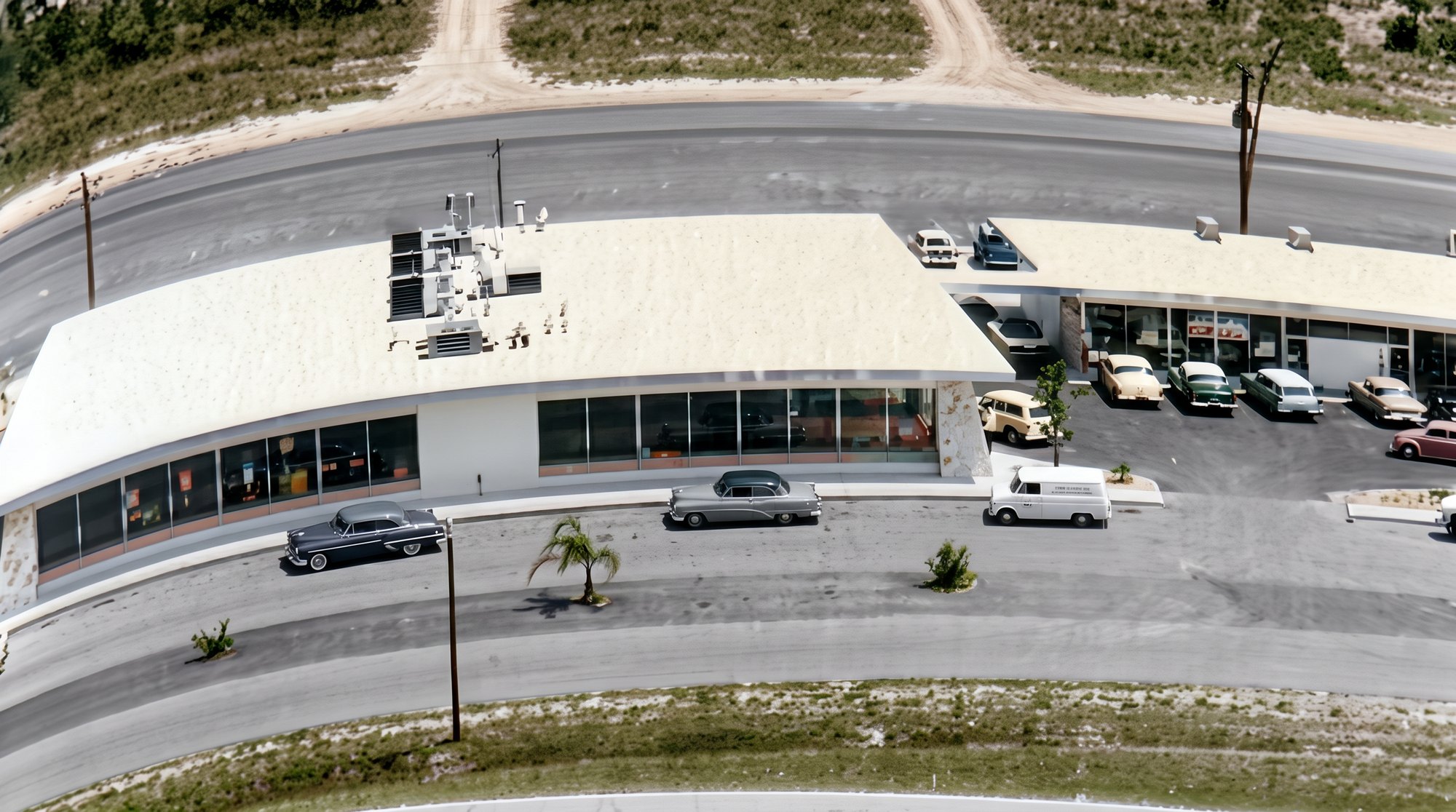 Colorized 1960 aerial of the Cape Coral Shopping Plaza with parked cars